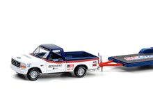 1992 Ford F-150 and 1992 Ford Bronco BFGoodrich Rough Riders on Flatbed Trailer