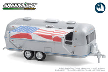 1972 Airstream Double-Axle Land Yacht Safari with American Flag Awning
