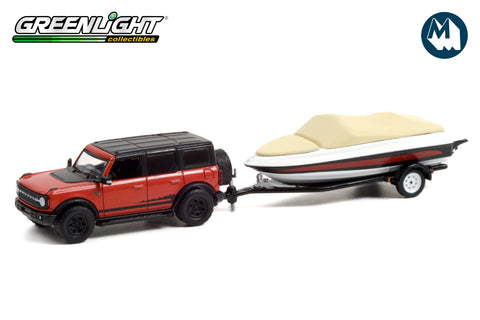 2021 Ford Bronco Wildtrak in Rapid Red Metallic with Boat Trailer
